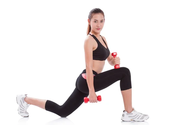 Sportovní žena cvičení s činkami — Stock fotografie