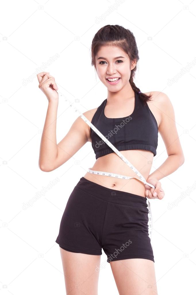 Fitness young woman with measuring tape