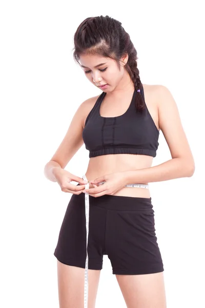 Mujer joven fitness con cinta métrica — Foto de Stock