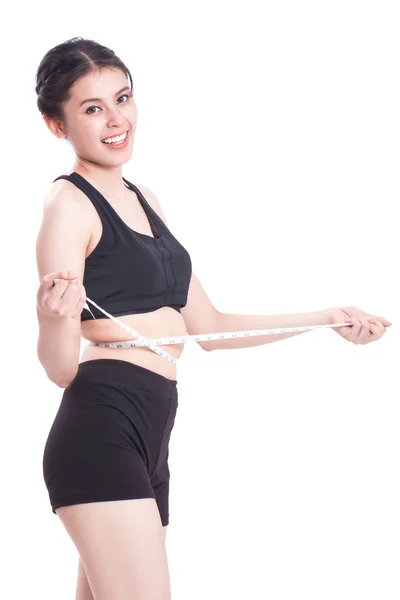 Fitness young woman with measuring tape — Stock Photo, Image