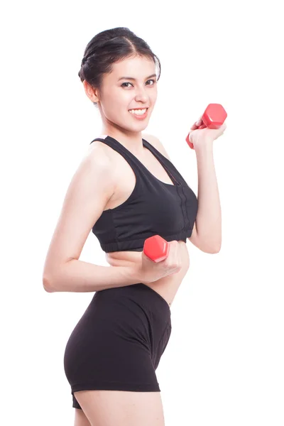 Sportovní žena cvičení s činkami — Stock fotografie