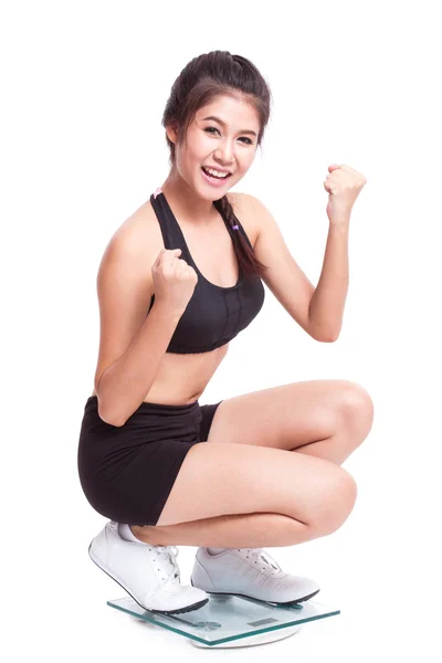 Fitness woman on scales — Stock Photo, Image