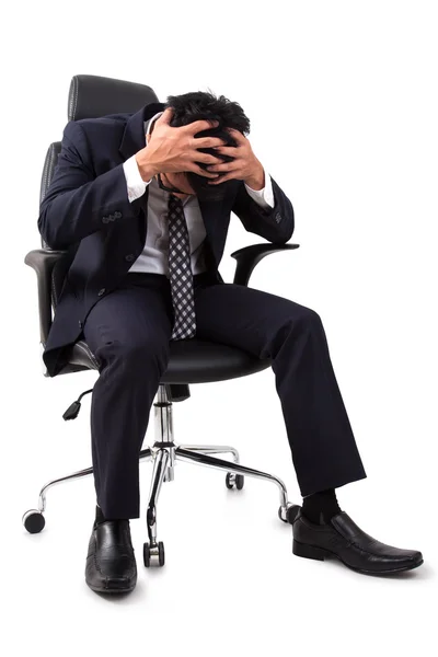 Stressed Businessman sitting in Armchair Royalty Free Stock Photos