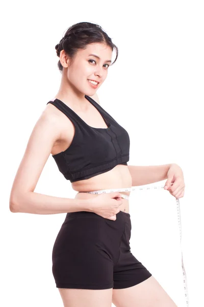 Fitness young woman with measuring tape — Stock Photo, Image