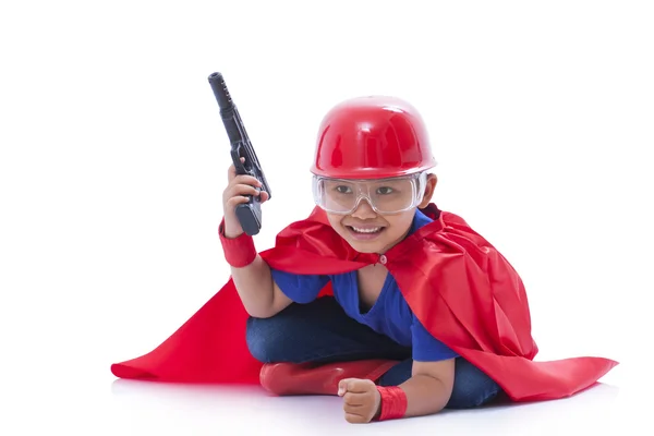 Pequeno menino super-herói com arma — Fotografia de Stock