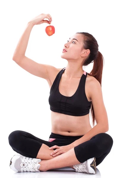 Fitness jonge vrouw bedrijf apple — Stockfoto