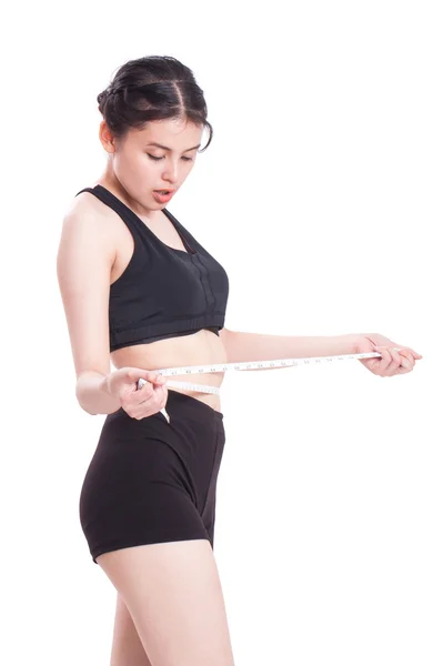 Fitness young woman with measuring tape — Stock Photo, Image