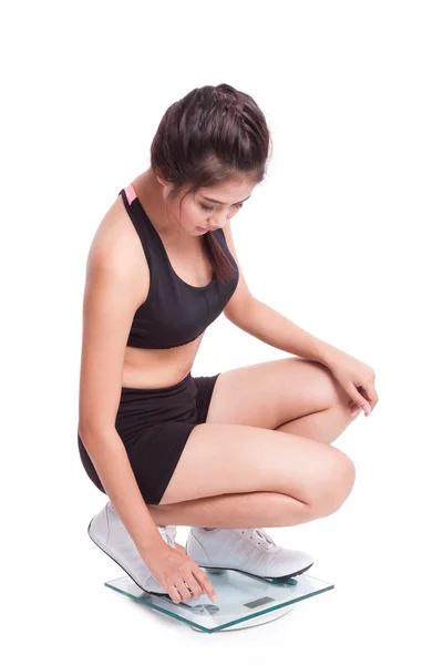 Fitness woman on scales — Stock Photo, Image
