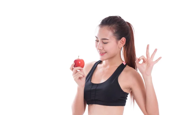 Fitness jonge vrouw bedrijf apple — Stockfoto