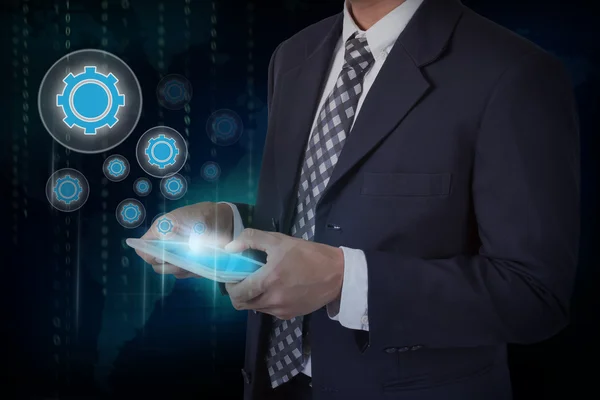 Businessman touching gear icons — Stock Photo, Image