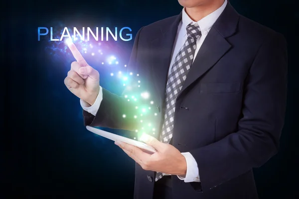 Businessman pressing planning sign — Stock Photo, Image