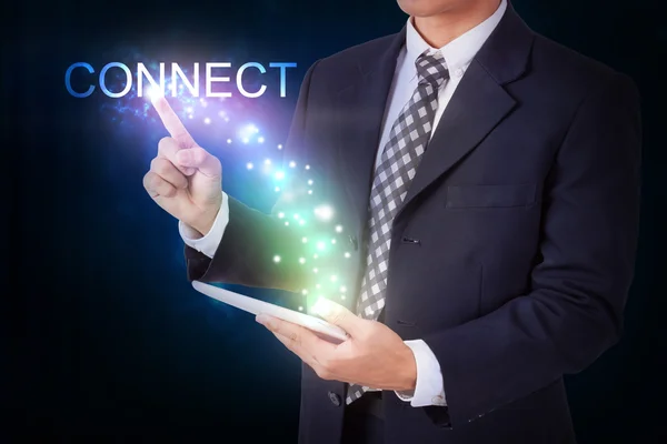 Man with tablet pressing connect symbol — Stock Photo, Image