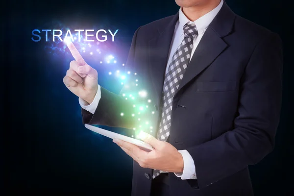 Businessman pressing strategy sign — Stock Photo, Image