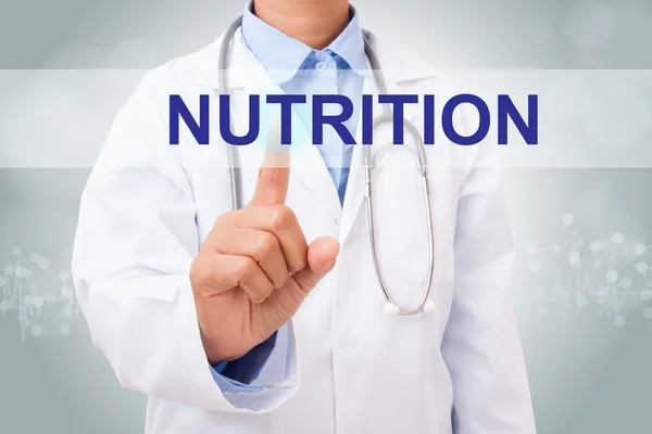 Médico tocando signo de nutrición —  Fotos de Stock