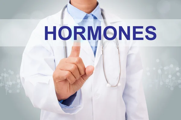 Doctor touching hormones sign — Stock Photo, Image
