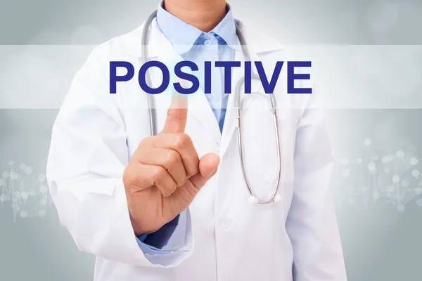 Doctor touching positive sign — Stock Photo, Image