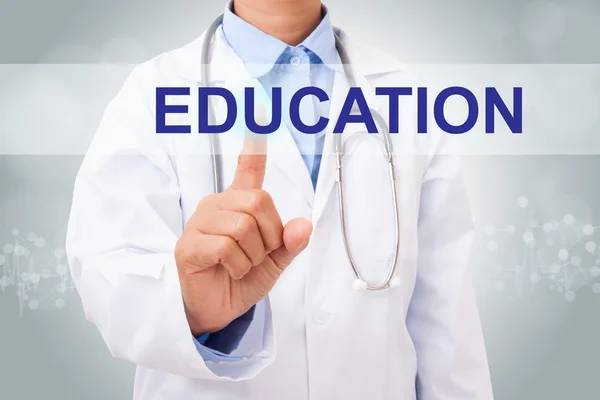 Doctor touching education sign — Stock Photo, Image