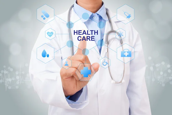 Doctor touching health care sign — Stock Photo, Image