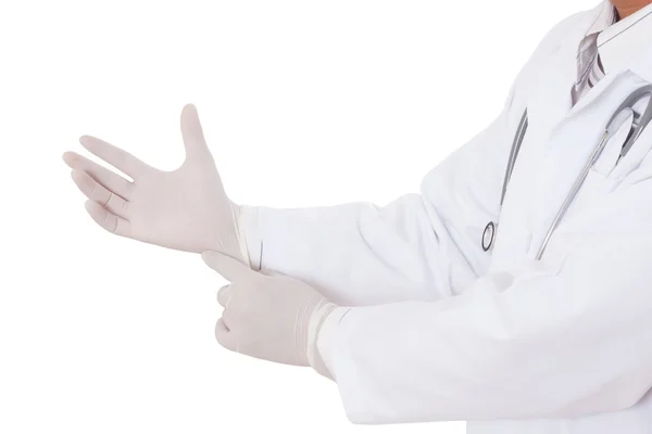 Lastik eldiven üzerinde koyarak doktor — Stok fotoğraf