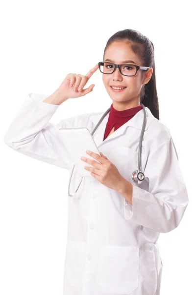 Female doctor using a digital tablet with thinking. — Stock Photo, Image