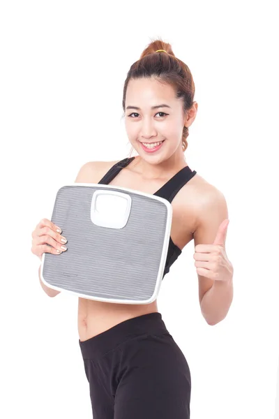 Woman with weight scales — Stock Photo, Image