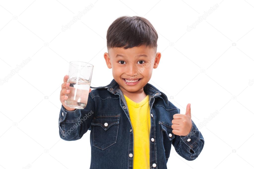 Boy holding glass of water