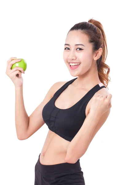 Фітнес молода жінка тримає яблуко — стокове фото