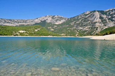 Beautiful lake in the French mountains with clear turquoise water
