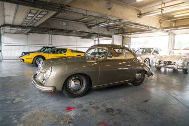Brno, Czech Republic - October 10, 2025: Rare historic sports car Porsche 356 from the 1950s. Luxury old German car stands in the garage.
