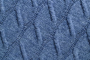 Örgü arkaplan dokusu. Yünlü gri kumaş örgü. Tekstil siyah çeşitliydi..