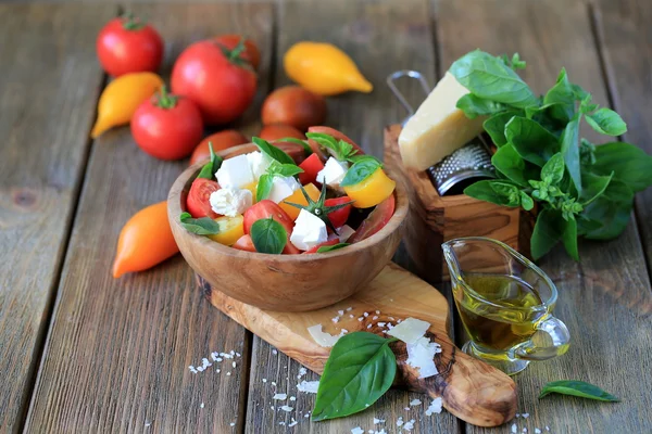 Summer salad with cheese, tomatoes and basil Stock Image