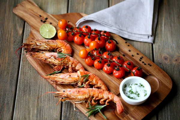 Tiger prawns with cherry tomatoes Stock Photo