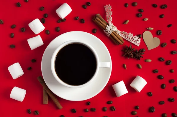 Coffee with spices and marshmallow on red textile background. Va — Stock Photo, Image