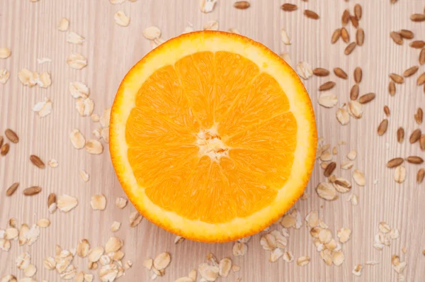 Half an orange on the table closeup — Stock Photo, Image