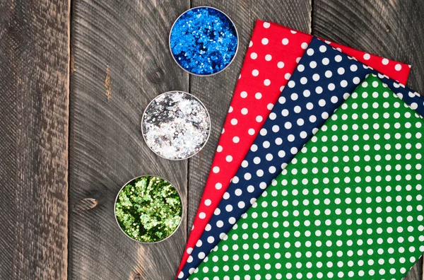 Cotton polka dots textile for needlework and glitter on old wood — Stockfoto