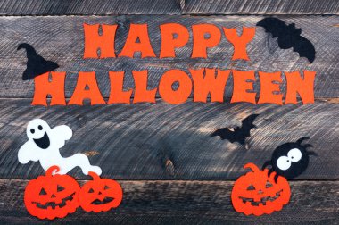 Cadılar Bayramı tatil eski ahşap masa arka planda. El yapımı kelime