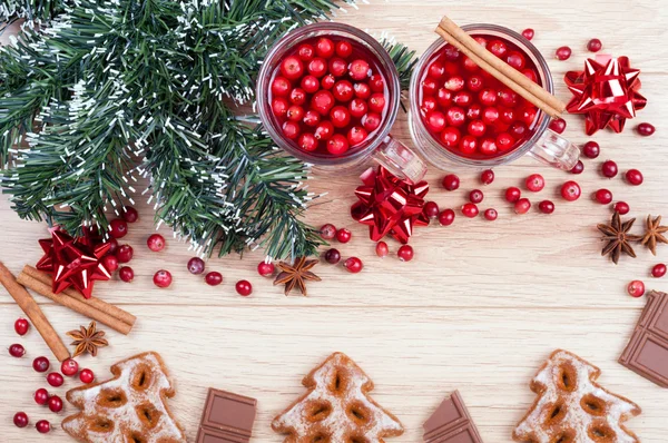 Christmas background. Tea with cranberries and cinnamon, cookies — Stock Photo, Image