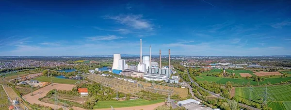 Aerial view of coal fired power plant during daytime with sunshine and clear sky