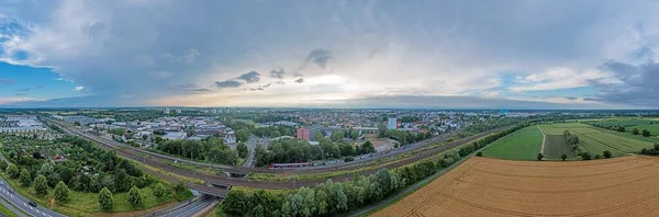 Drone panorama of German district town Gross-Gerau in south Hesse in the evening against cloudy sky