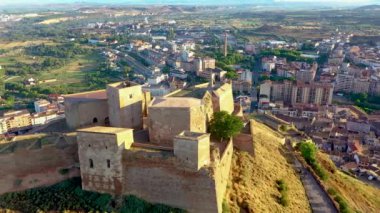 Drone video of Monzon castle in northern Spain in the morning during sunrise in summer