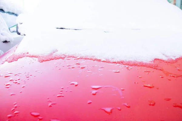 snow melting on car
