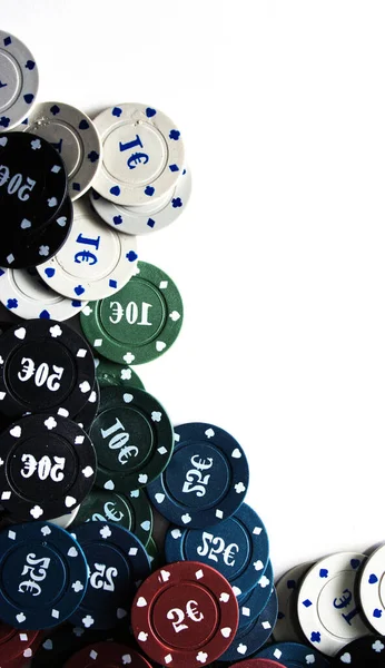 Plastic casino chips stacked on white background. Poker game