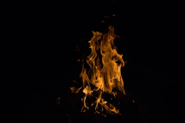 bright fire on a black background at night