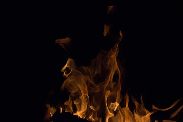 bright fire on a black background at night