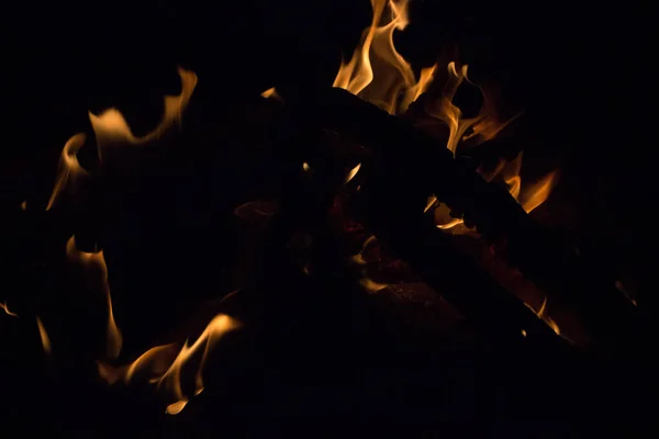 bright fire on a black background at night