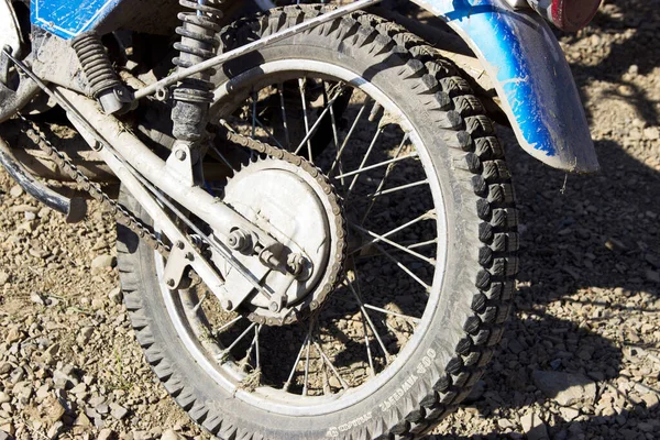 Motorcycle wheel on ground at daytime