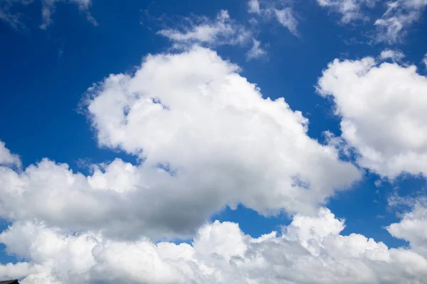 Image of the sky, big rainy clouds. Blue sky with white clouds.