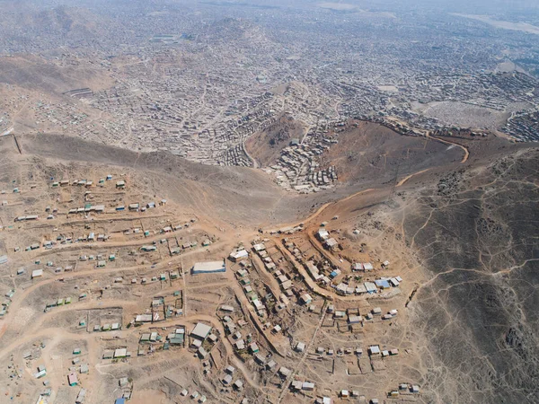 Aerial image of Lima Peru, shanty town in the hills. Image of Andes hills invaded. Small town, poverty.