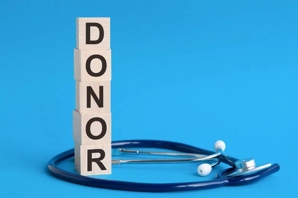 Donor Word Written Wooden Blocks Stethoscope Light Blue Background Insurance — Stock Photo, Image
