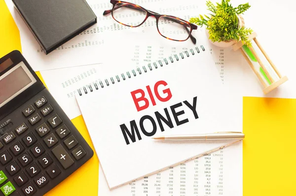 Writing text showing BIG MONEY. Writing text BIG MONEY on white paper card, red and black letters, yellow background. Business concept.